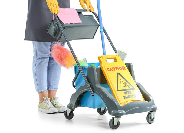 Worker of cleaning service with trolley on white background - Photo, Image