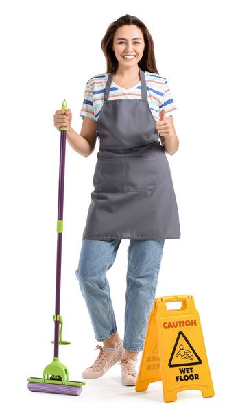 Young woman with floor mop showing thumb-up on white background - Foto, Imagen