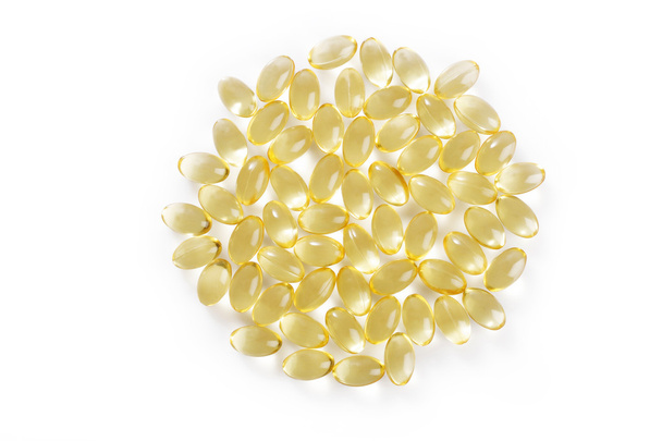 cod liver fish oil capsule on white background - Foto, afbeelding