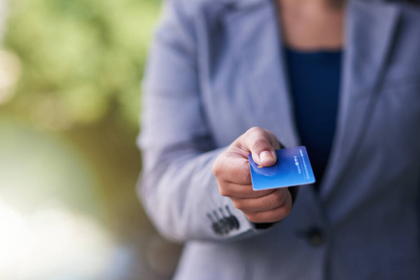 Put it on my business account. Shot of a businesswoman holding out a credit card. - Φωτογραφία, εικόνα