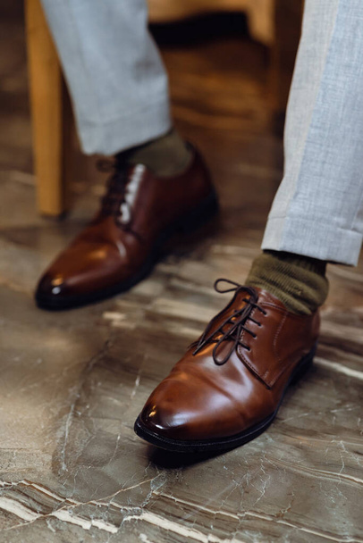 man's shoes on a wooden background - Fotó, kép