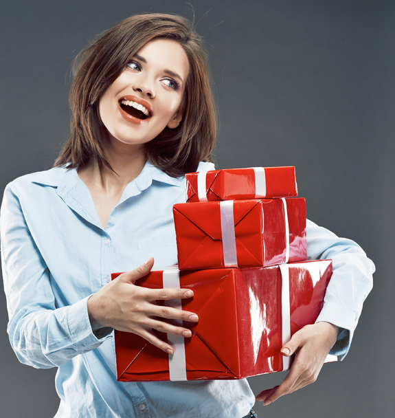 Young woman holding red gift box. - Photo, Image