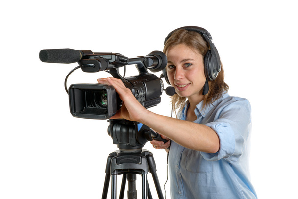 Mujer joven con una cámara de vídeo
 - Foto, imagen
