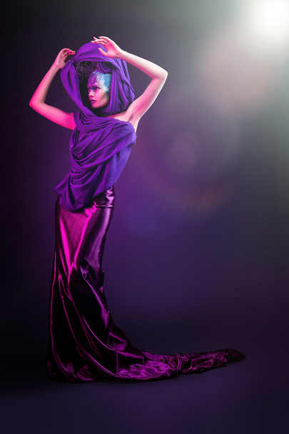 Slim woman in purple light - Valokuva, kuva