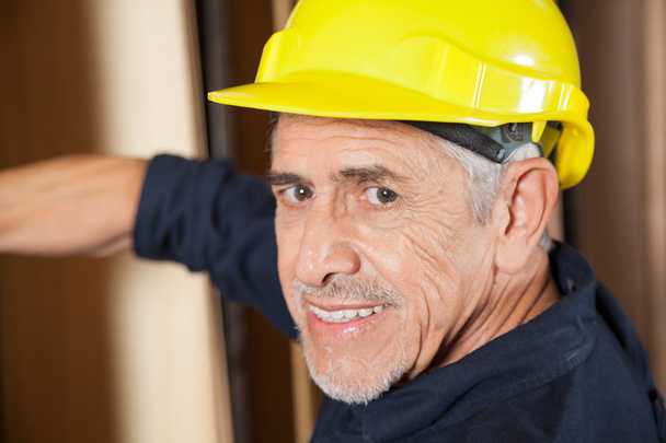 Portrait Of Senior Carpenter Smiling - Foto, Imagen