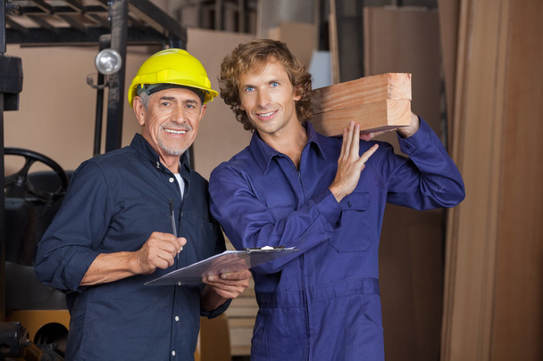Carpenters With Clipboard And Wooden Planks - Photo, image