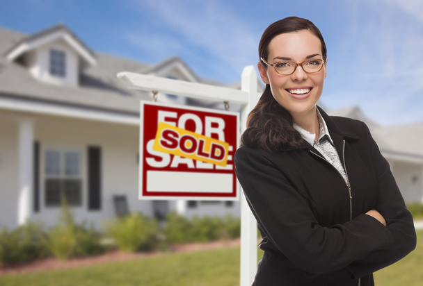 Mixed Race Woman in Front of House and Sold Sign - Photo, Image