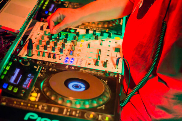 DJs are turntablism turntables plate mixer night party pub Motion blur abstract background. - 写真・画像
