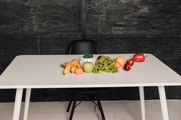 Vegetables and fruits are on a white table - Photo, Image