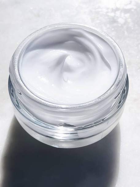 Face cream moisturiser, glass jar on marble stone background, skincare and cosmetic, beauty product concept - Φωτογραφία, εικόνα