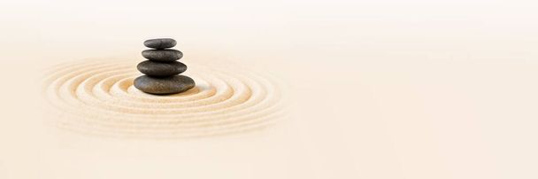 Black stones pile in the sand. Zen japanese garden background scene. Horizontal banner - Photo, Image