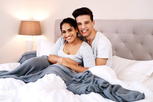 We couldnt be happier. Shot of a young couple spending quality time in bed. - Fotó, kép