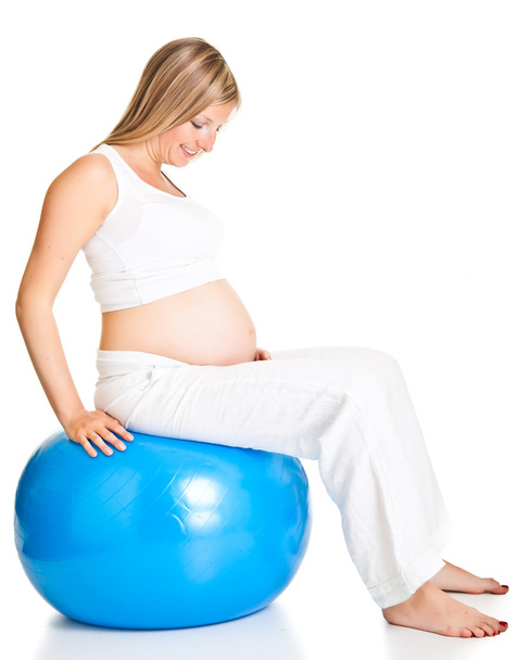 Pregnant woman excercises with gymnastic ball - Fotoğraf, Görsel