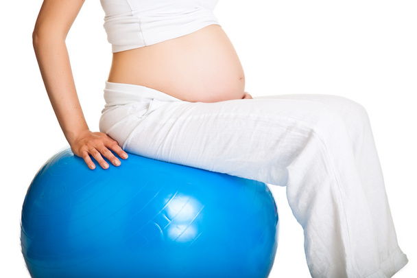 Pregnant woman excercises with gymnastic ball - Zdjęcie, obraz