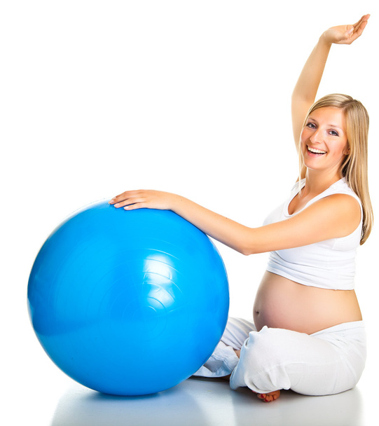 Ejercicios de mujer embarazada con pelota de gimnasia
 - Foto, imagen