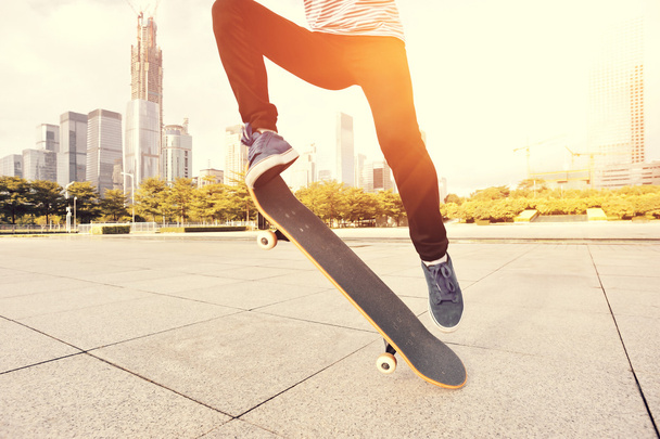 Skateboarding woman legs at skatepark - 写真・画像