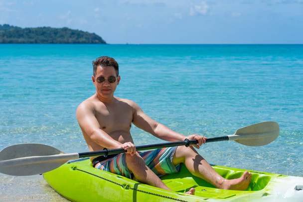 Adult Man Kayaking in Blue Sea in Summer - Photo, Image
