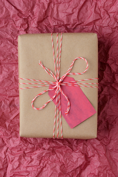 Christmas Gift on Red Tissue - Photo, image
