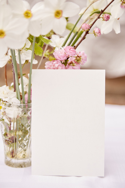 Spring rustic postcard mock up with vase of spring pink, white and yellow flowers. Woman's day, invitation, Mother's day, wedding, birthday card concept. Naturecore concept. Aesthetic cottagecore. - Fotó, kép