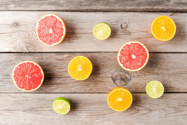 Fresh citruses on wooden table. Top view - Photo, Image