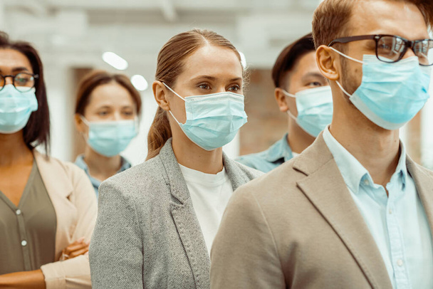 Multinational business people wearing protective face masks - Foto, Imagem