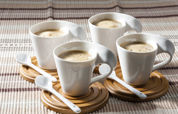cups of coffee on place mats - Φωτογραφία, εικόνα