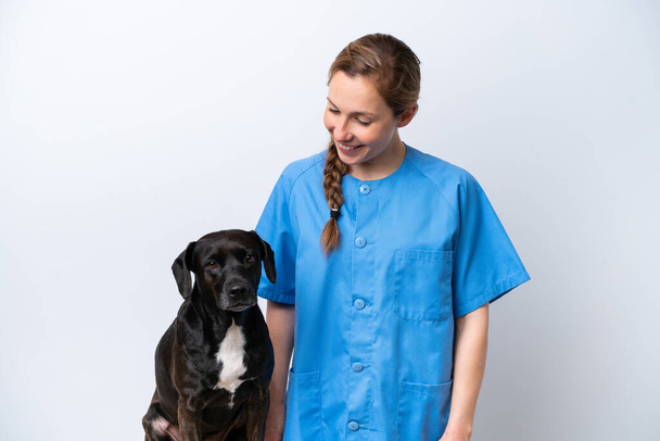 Young veterinarian woman with dog isolated on white background with happy expression - Φωτογραφία, εικόνα