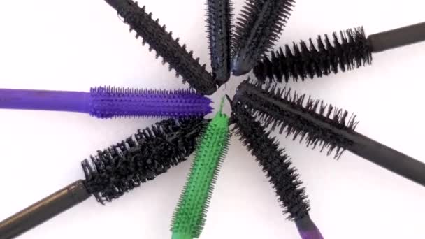 mascara brushes rotating on white background - Footage, Video
