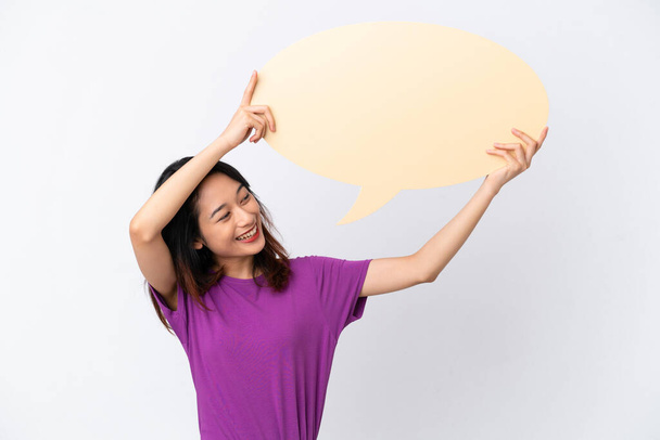 Young Vietnamese woman isolated on white background holding an empty speech bubble - Fotoğraf, Görsel