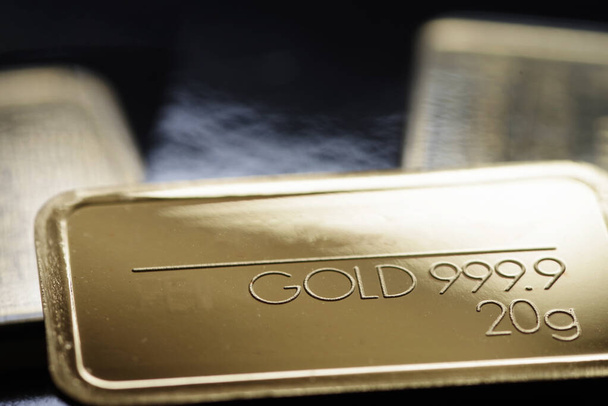 Minted gold bar weighing 20 grams. Selective focus. - Photo, Image