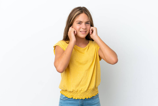 Little caucasian girl isolated on white background frustrated and covering ears - Photo, Image
