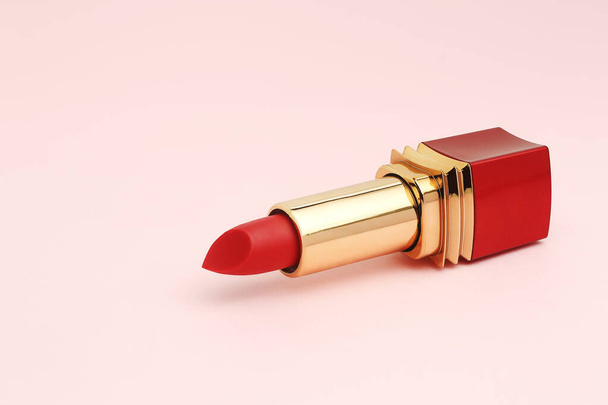 closeup of red lipstick on pink surface - Valokuva, kuva