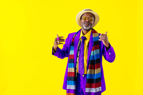 Cool senior man with fashionable clothing style portrait on colored background - Funny old male pensioner with eccentric style having fun - 写真・画像