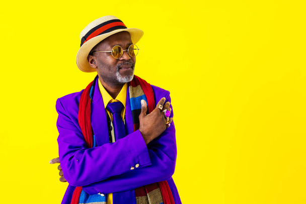 Cool senior man with fashionable clothing style portrait on colored background - Funny old male pensioner with eccentric style having fun - Foto, imagen