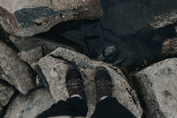 feet of a man on the rocks - Fotografie, Obrázek