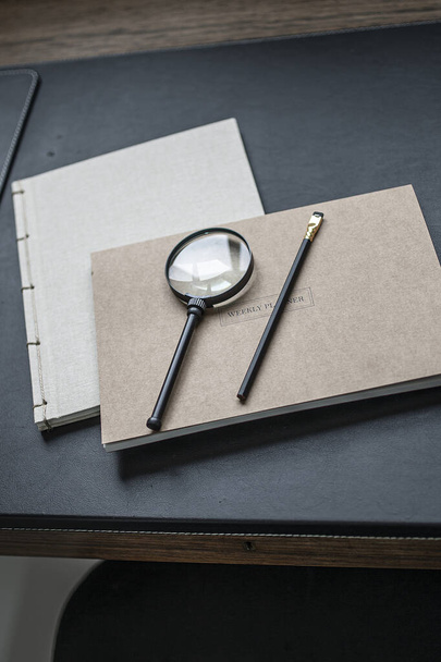 office desk with magnifying glass and pen - Photo, image