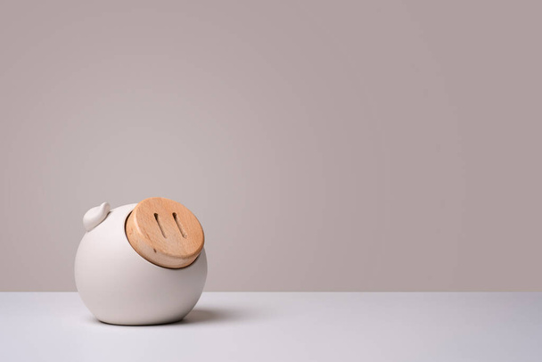 pig piggy bank isolated on light brown background. money saving concept - Фото, изображение