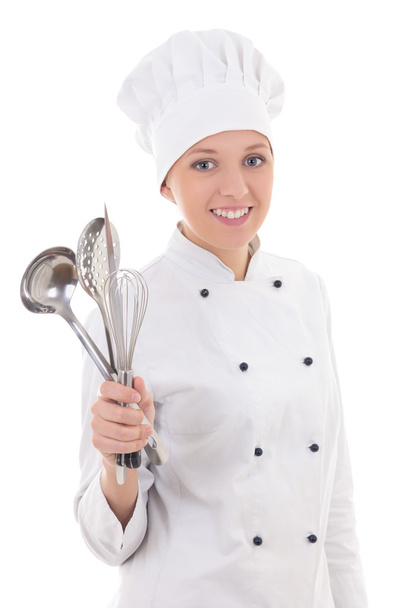 giovane donna in chef uniforme con attrezzatura da cucina isolato su w - Foto, immagini