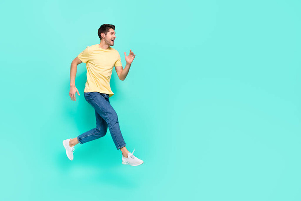 Full length profile photo of satisfied cheerful man run look empty space isolated on turquoise color background - Φωτογραφία, εικόνα
