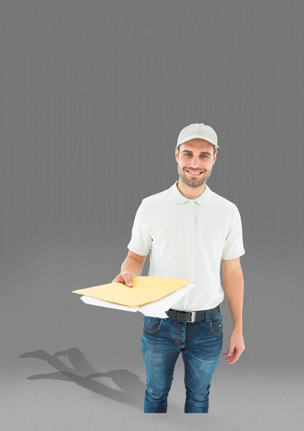 Portrait of caucasian male delivery man holding documents against copy space on grey background. logistics and transportation service concept - Foto, Imagen