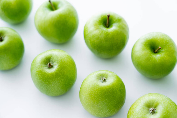 high angle view of delicious green apples on white - Foto, Imagem