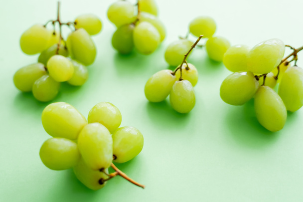 close up view of delicious grapes on green - Zdjęcie, obraz