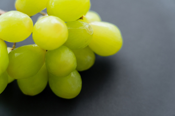 close up view of fresh grapes on black - Φωτογραφία, εικόνα