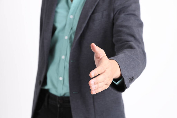 The young adult businessman standing on the white background. - Photo, Image