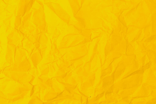Rough crumpled texture surface of retro old vintage classic grunge paper. Background or backdrop. Design blank. Pure or mostly pure yellow - Foto, Imagen