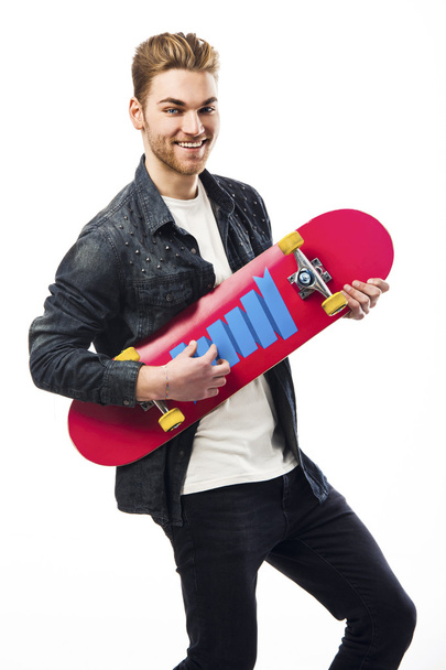Young man with a skateboard - Fotoğraf, Görsel