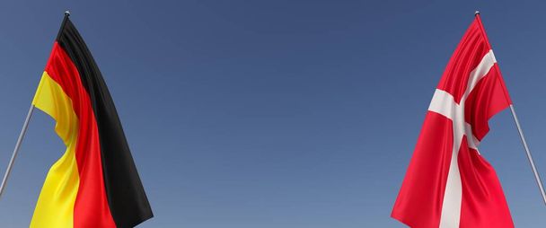Флаги Германии и Дании на флагштоках по бокам на синем фоне. Место для смс. Флаги развеваются на ветру. Немецкий, Берлин. Датский, Копенгаген. 3d иллюстрация. - Фото, изображение