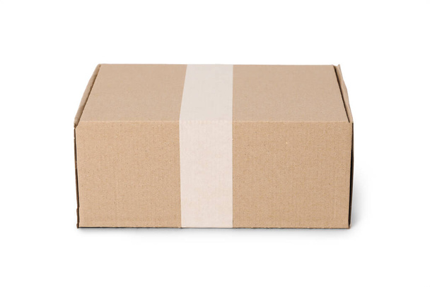 One closed cardboard box isolated on white - Photo, Image