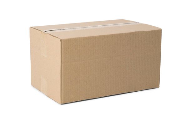 One closed cardboard box isolated on white - Valokuva, kuva