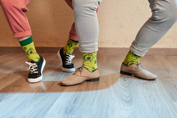 Feet of lindy hop dancers with avocado socks - Фото, зображення